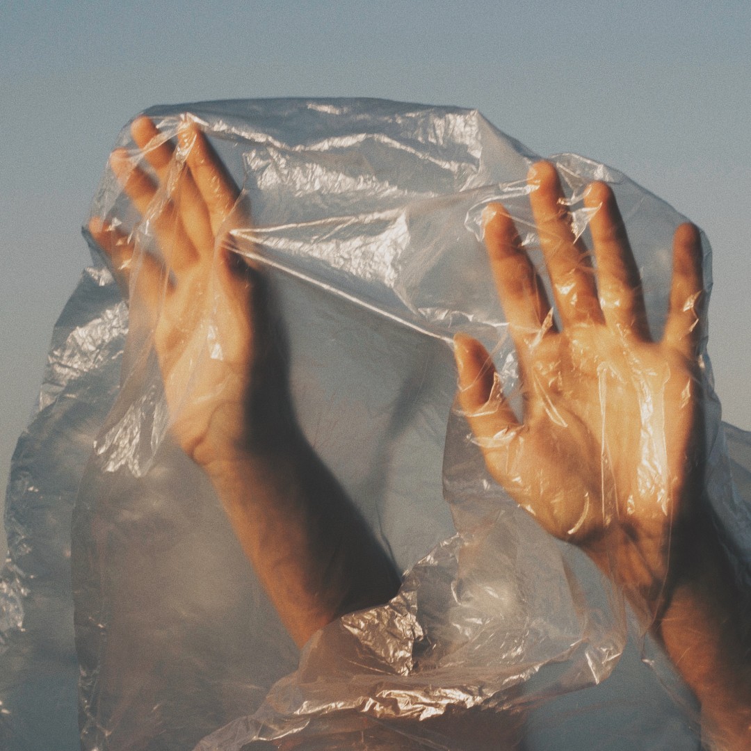 image of plastic and hands